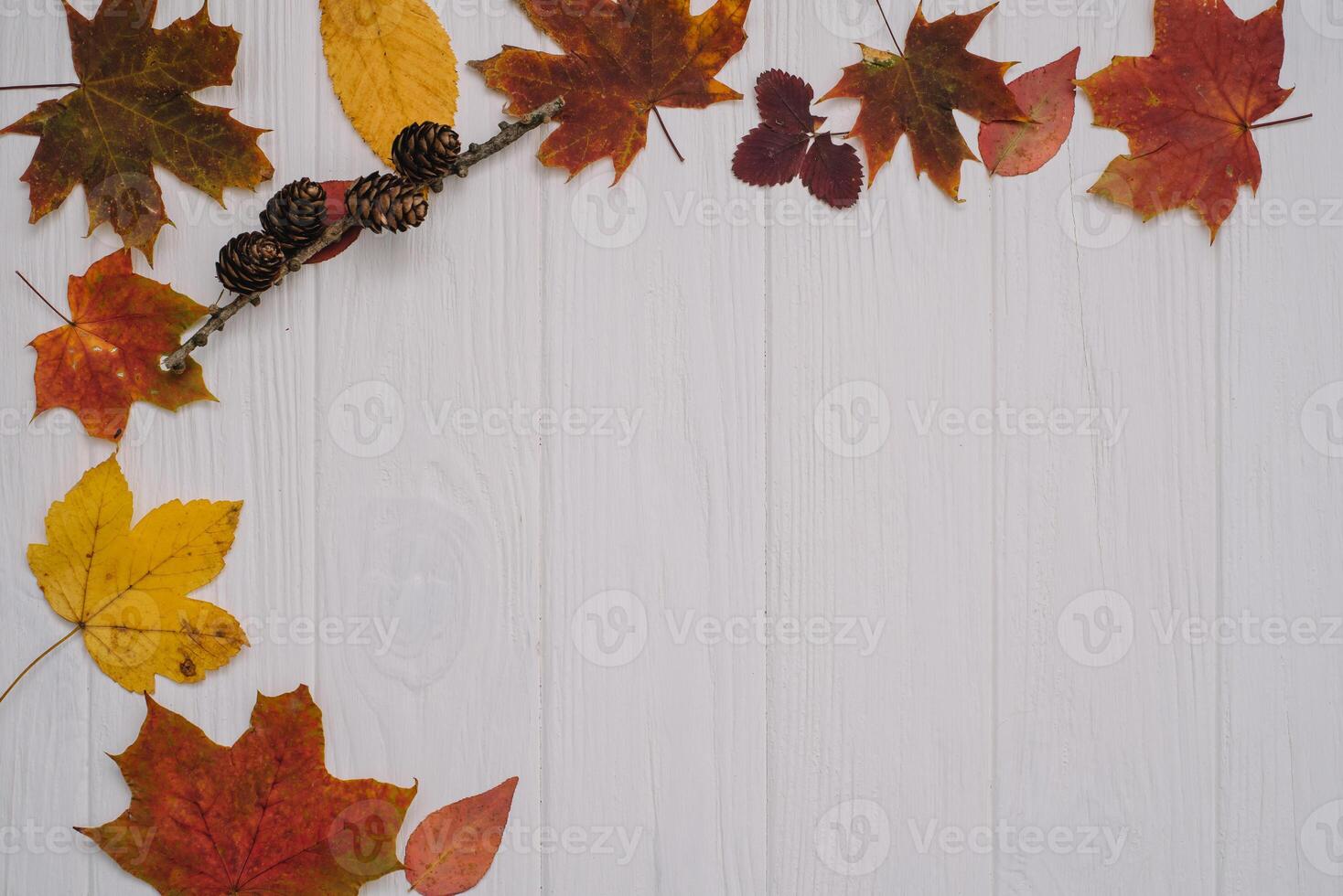Background texture with old wooden table and yellow autumnal leaves. Autumn maple leaves on wooden background with copy space. Top view. photo