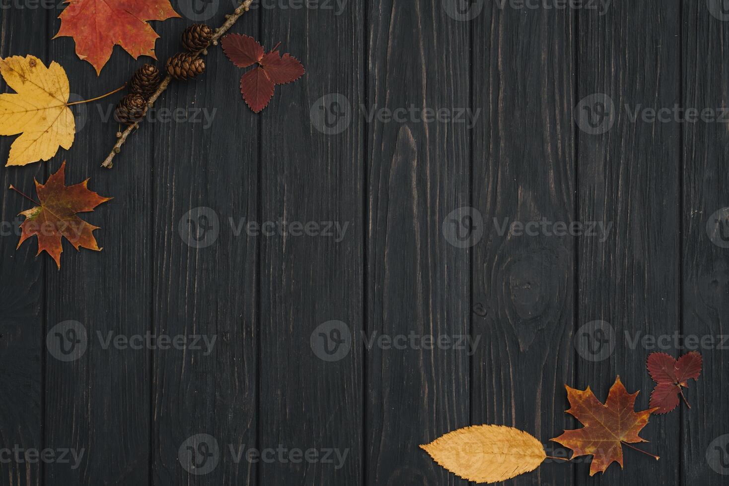 Background texture with old wooden table and yellow autumnal leaves. Autumn maple leaves on wooden background with copy space. Top view. photo