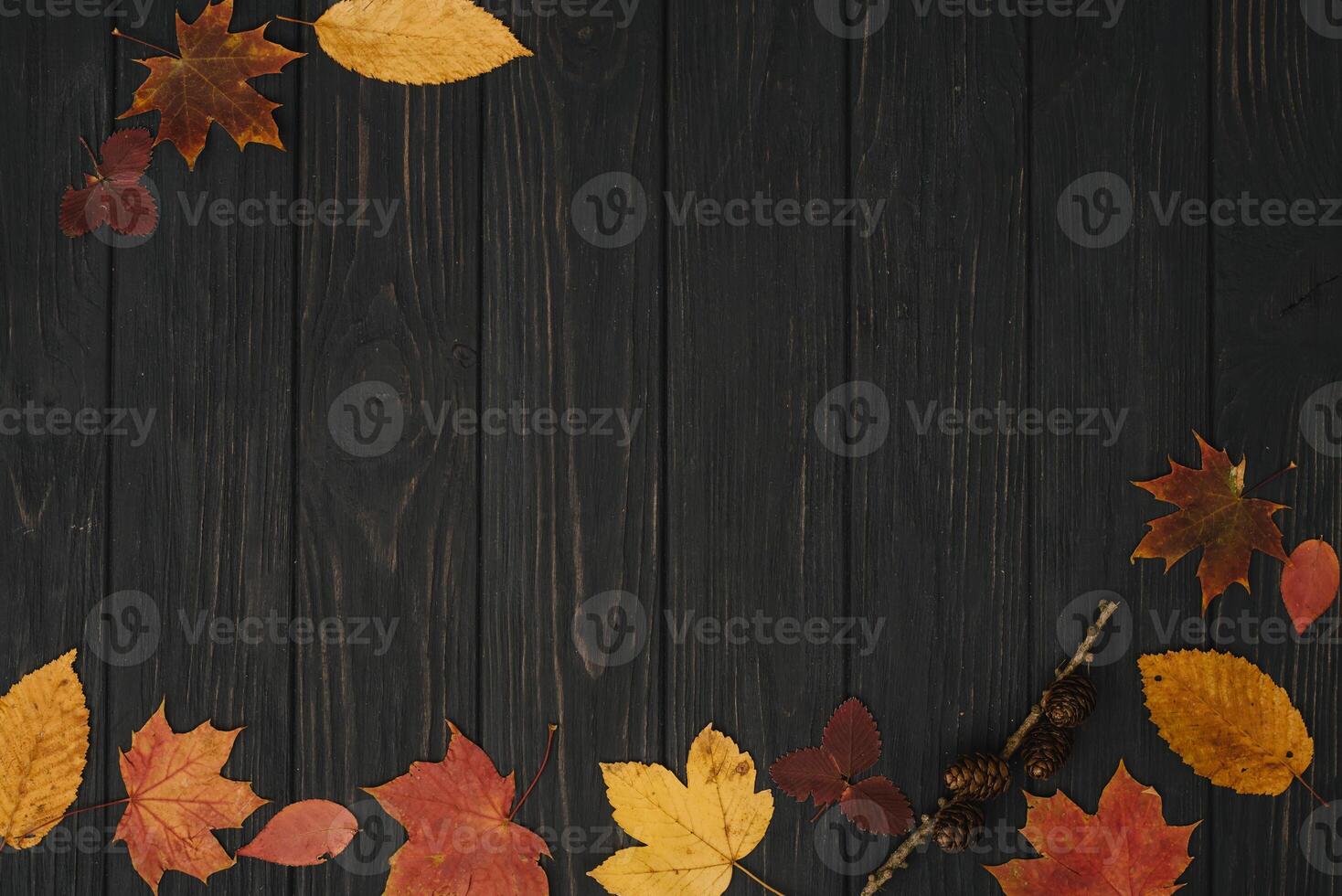 Background texture with old wooden table and yellow autumnal leaves. Autumn maple leaves on wooden background with copy space. Top view. photo