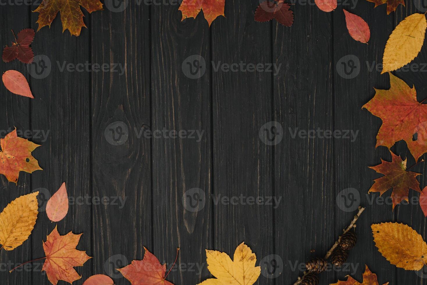 Background texture with old wooden table and yellow autumnal leaves. Autumn maple leaves on wooden background with copy space. Top view. photo