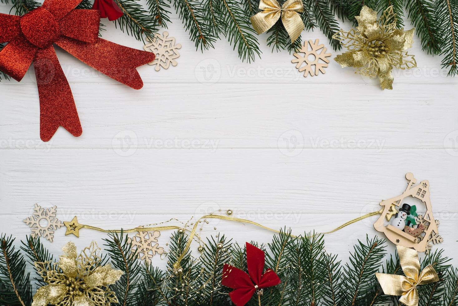 Christmas fir tree with decoration and glitters on wooden background. Christmas background on the white wooden desk photo