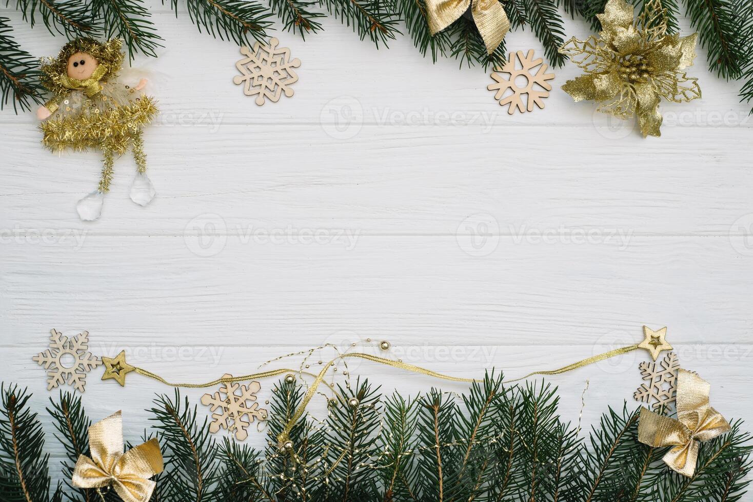 Christmas fir tree with decoration and glitters on wooden background. Christmas background on the white wooden desk photo