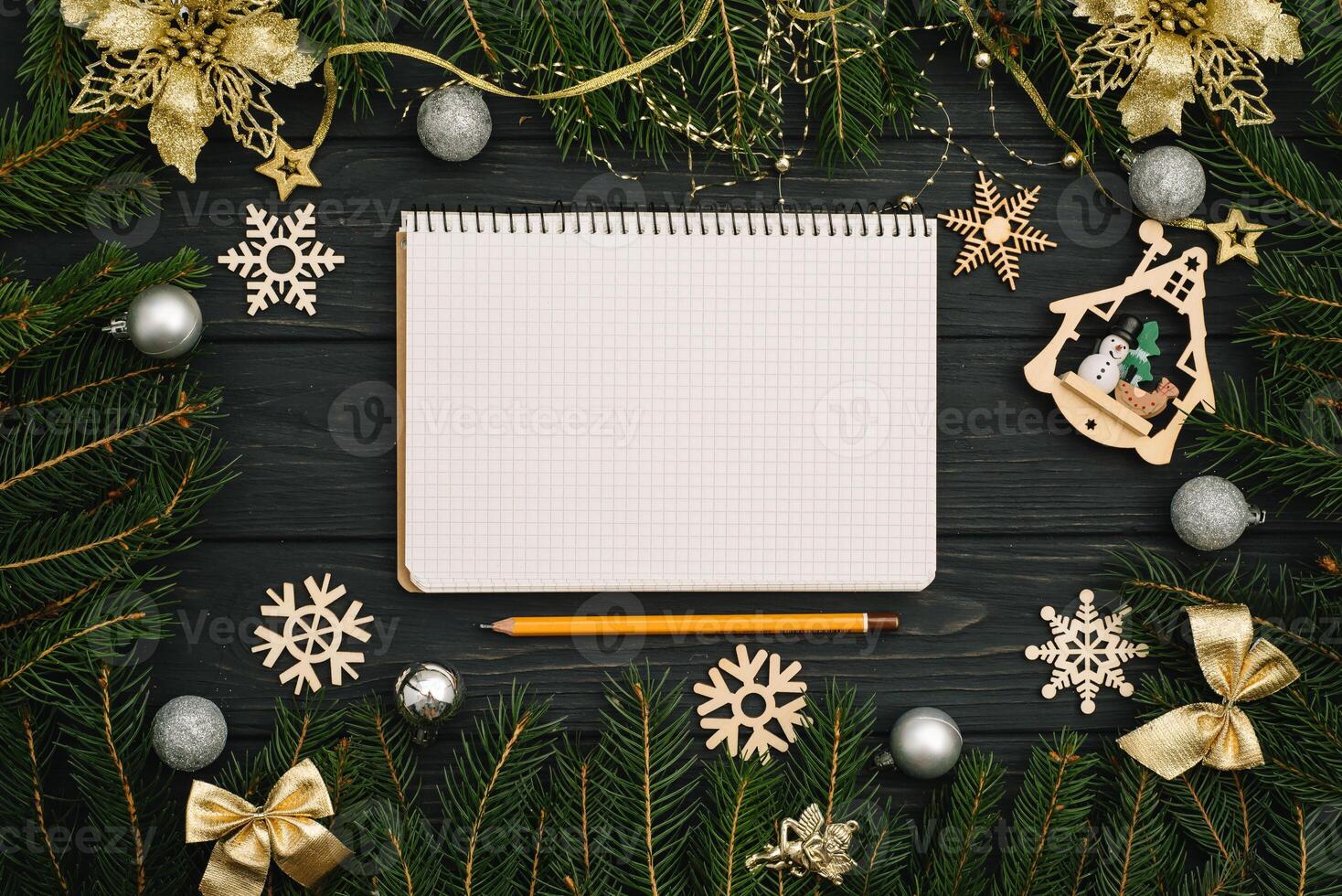 Christmas or New Year dark wooden background, Xmas black board framed with season decorations, space for a text, view from above photo
