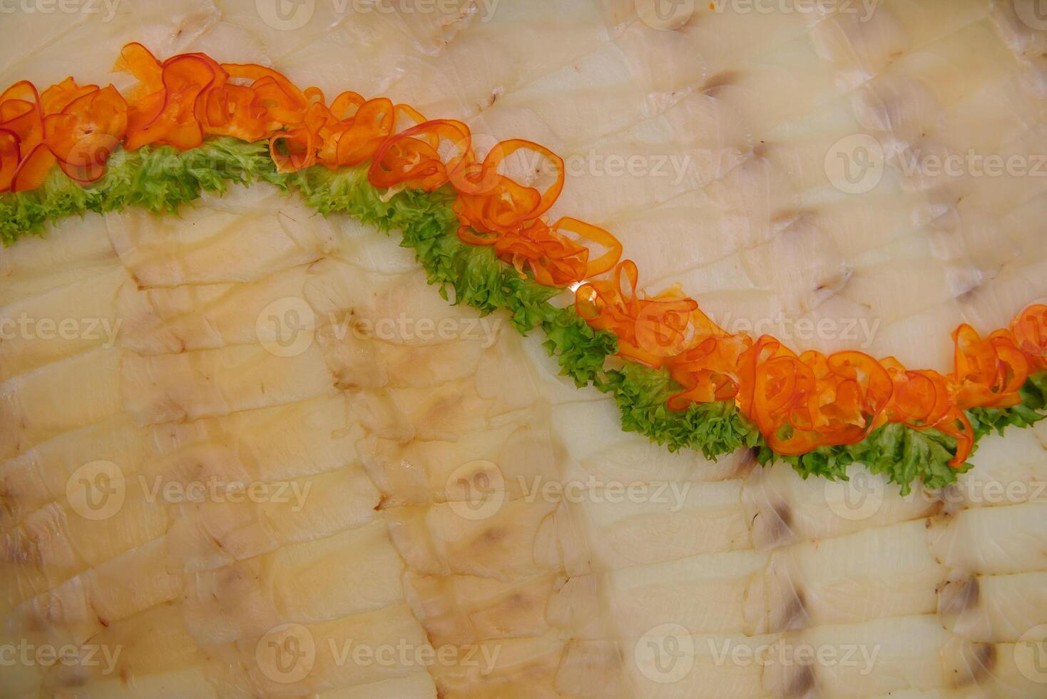 Elegant Restaurant Plate with Fish Delicacies Top View. Smoked Butter Fish with Lemon. smoked fish with lemon buffet. photo