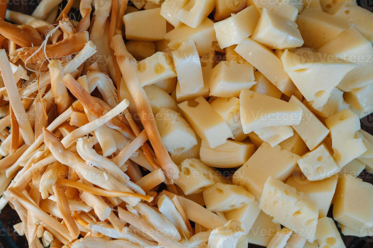 Mix of snacks pretzels , crackers , chips , nuts and nachos. Lager beer and snacks on stone table. Nuts, chips, pretzel. Top view with copy space. photo