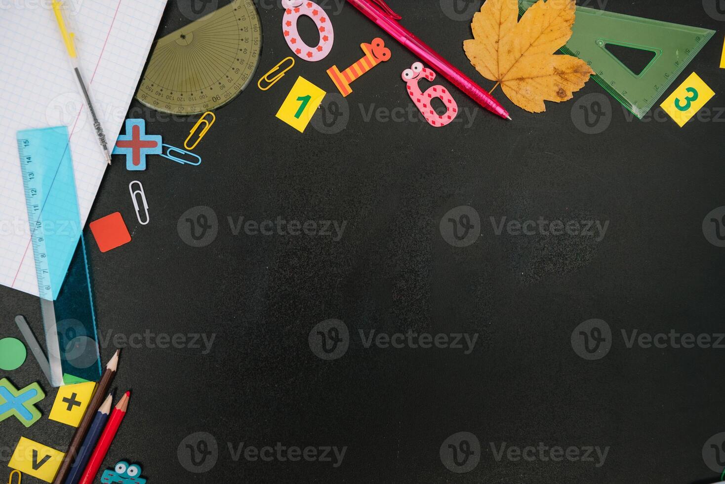 Back to school concept. School and office supplies on blackboard background. Flat lay with copy space photo