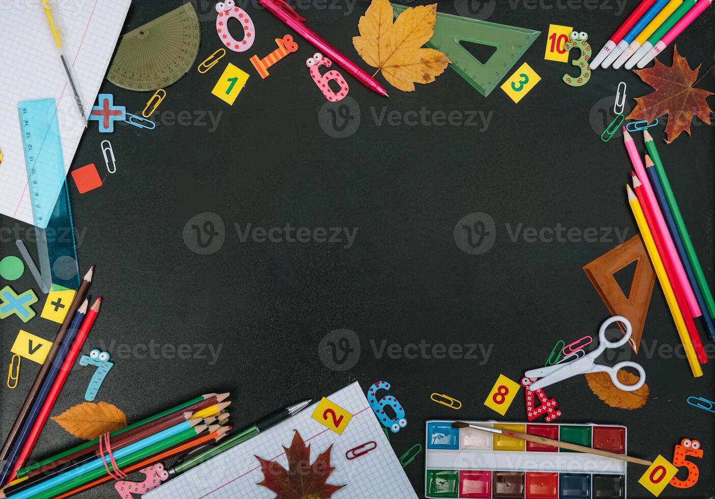 Back to school concept. School and office supplies on blackboard background. Flat lay with copy space photo