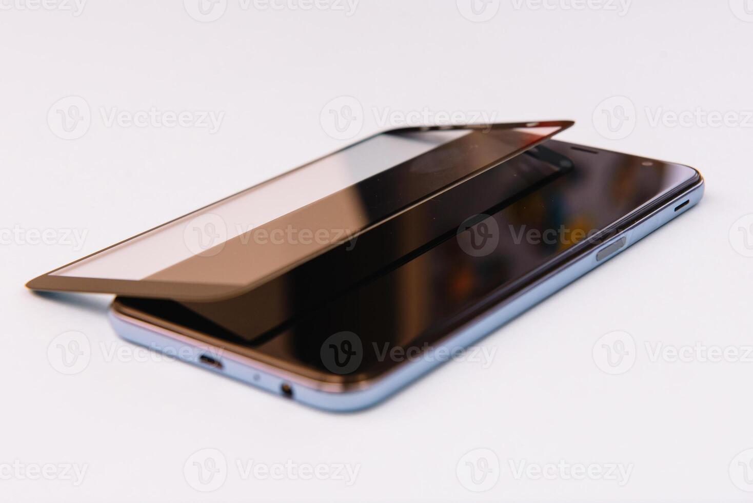 Smart phone with tempered glass shield,film screen cover .protector concepts ideas. white background photo