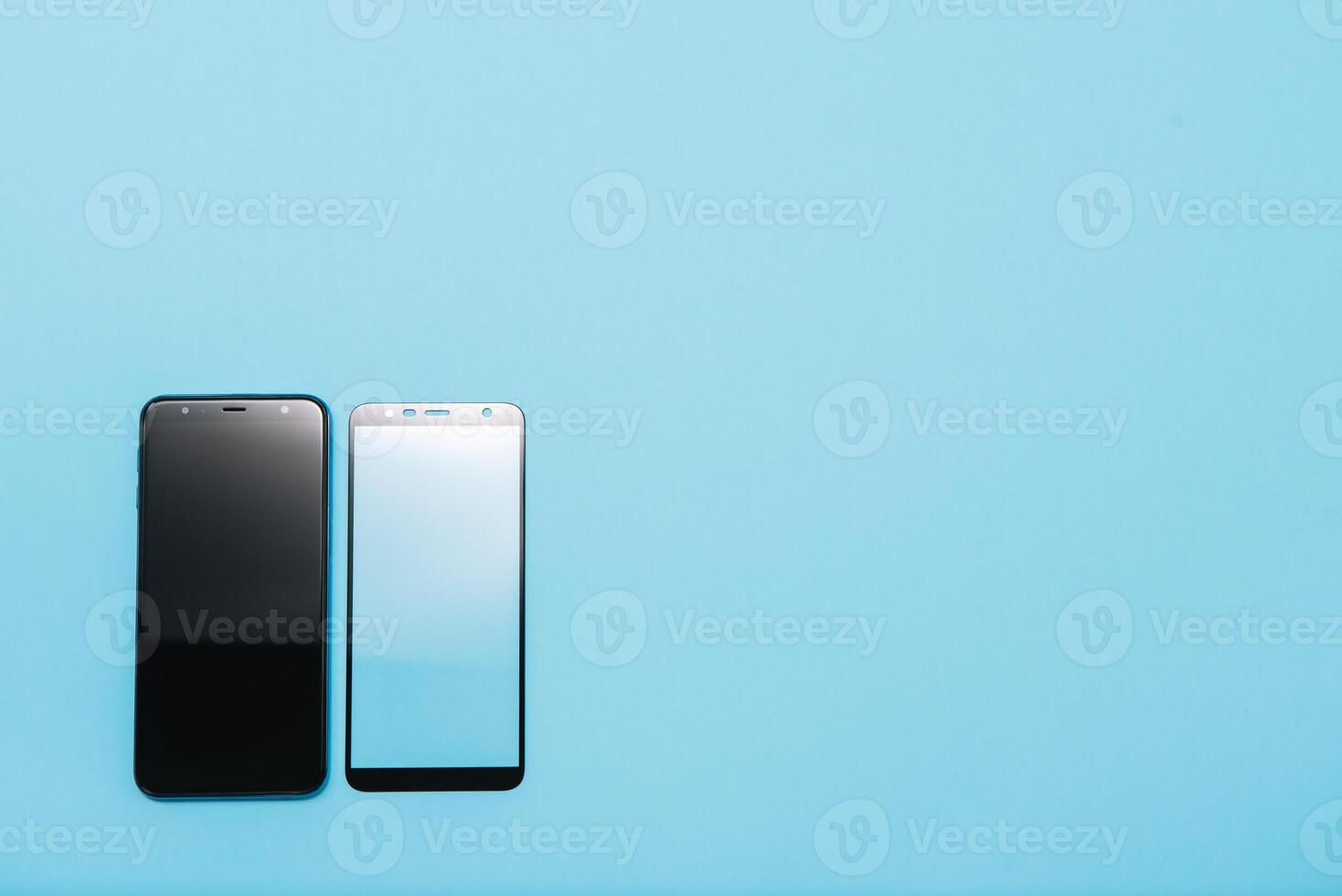 Smart phone with tempered glass shield,film screen cover .protector concepts ideas. blue background photo