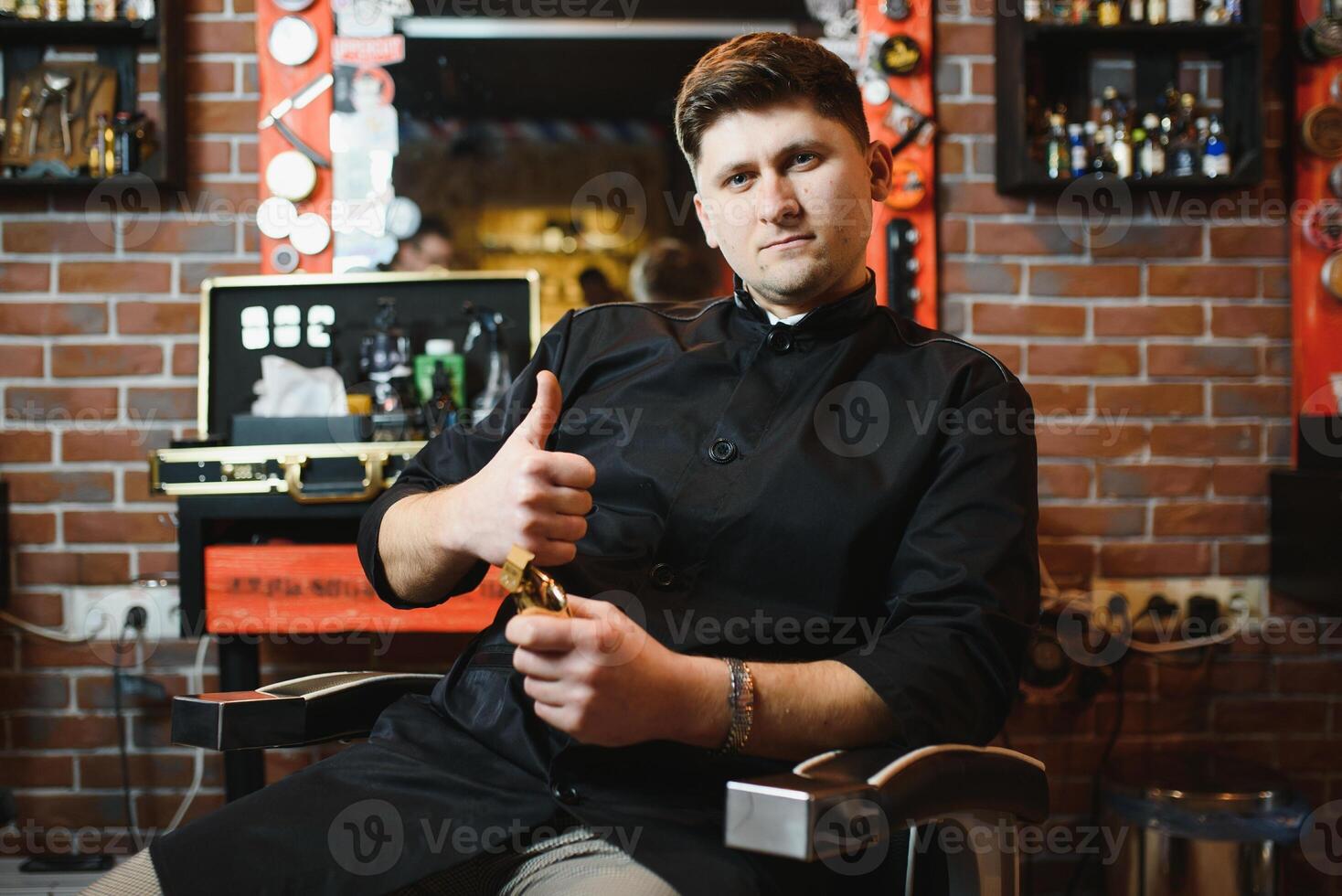 Hairdresser. Salon for men. Barbershop concept. Handsome man with barber tools. Professional beard and hair care. photo