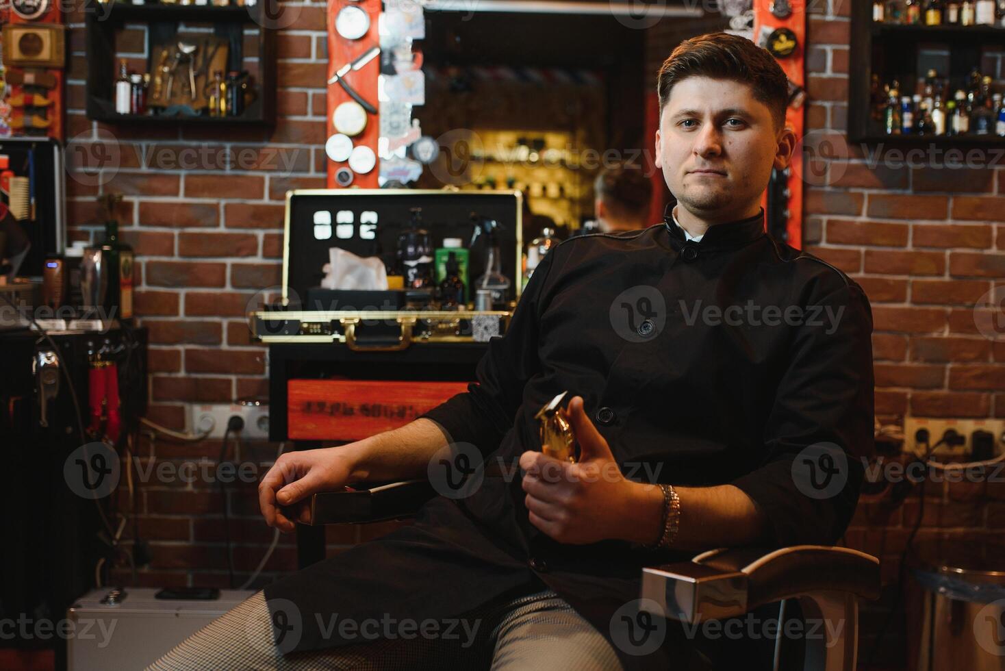 Hairdresser. Salon for men. Barbershop concept. Handsome man with barber tools. Professional beard and hair care. photo
