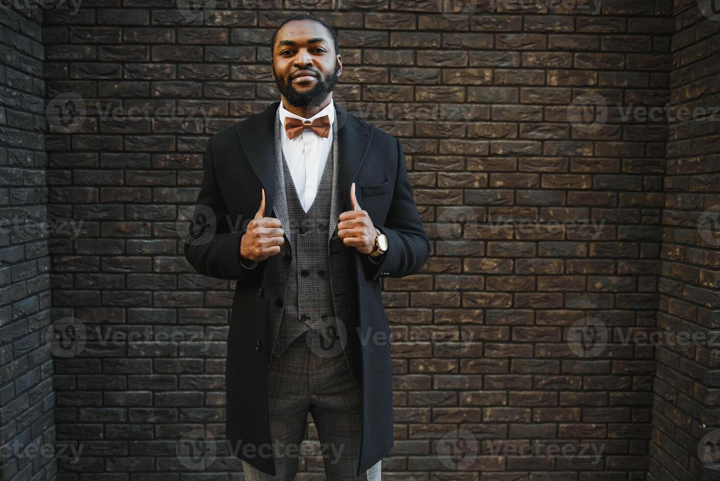 Portrait of an African American businessman wearing a suit standing in an outdoor business environment photo