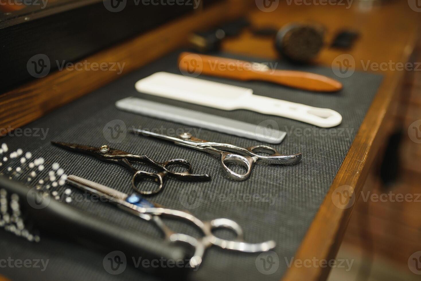 Vintage barber shop tools on old wooden background photo