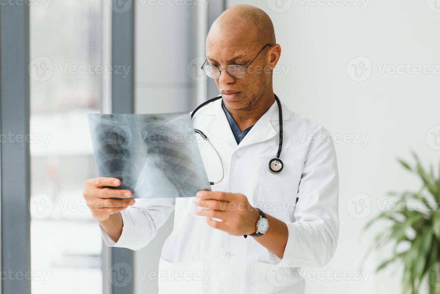 African doctor looking at a radiography. photo
