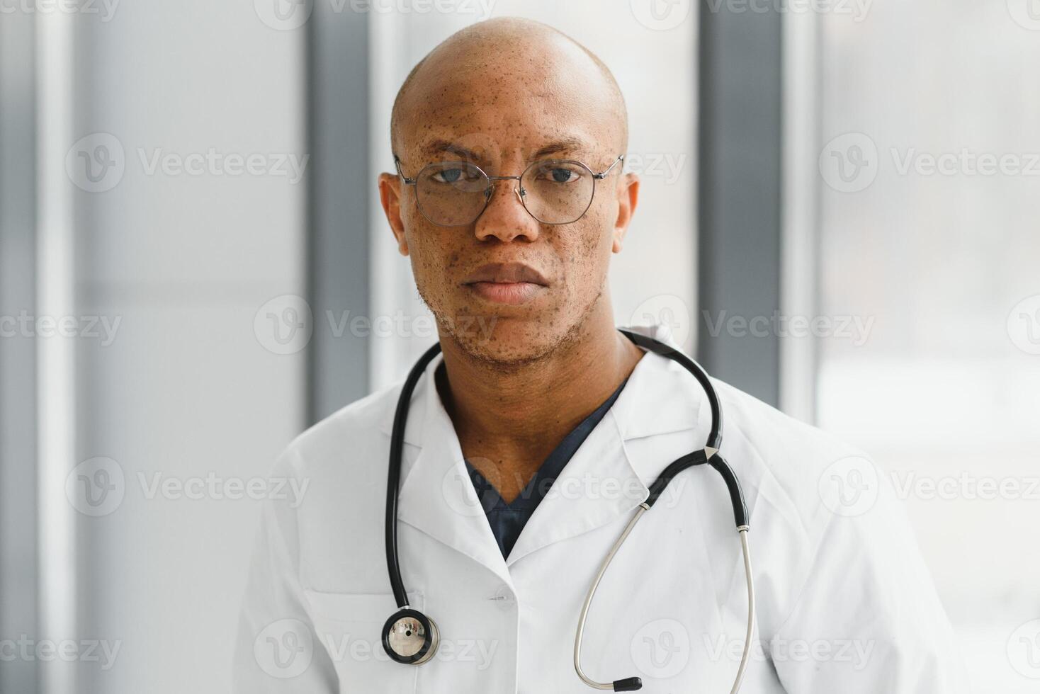 African American man male hospital doctor in white coat with stethoscope. photo