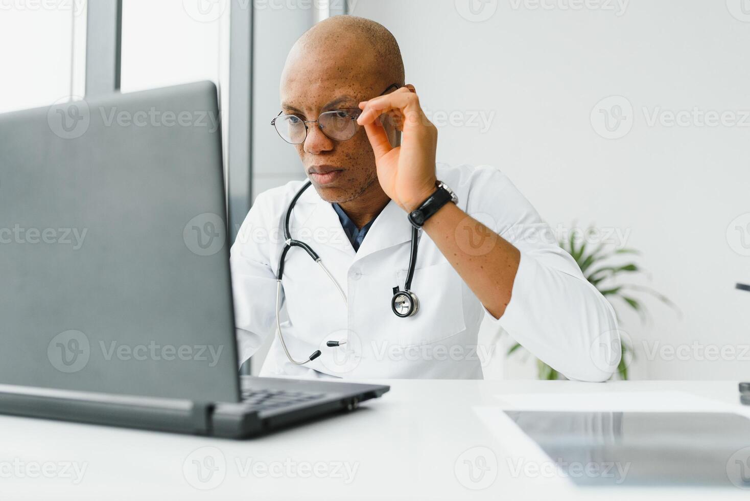 young male african doctor in hospital. photo