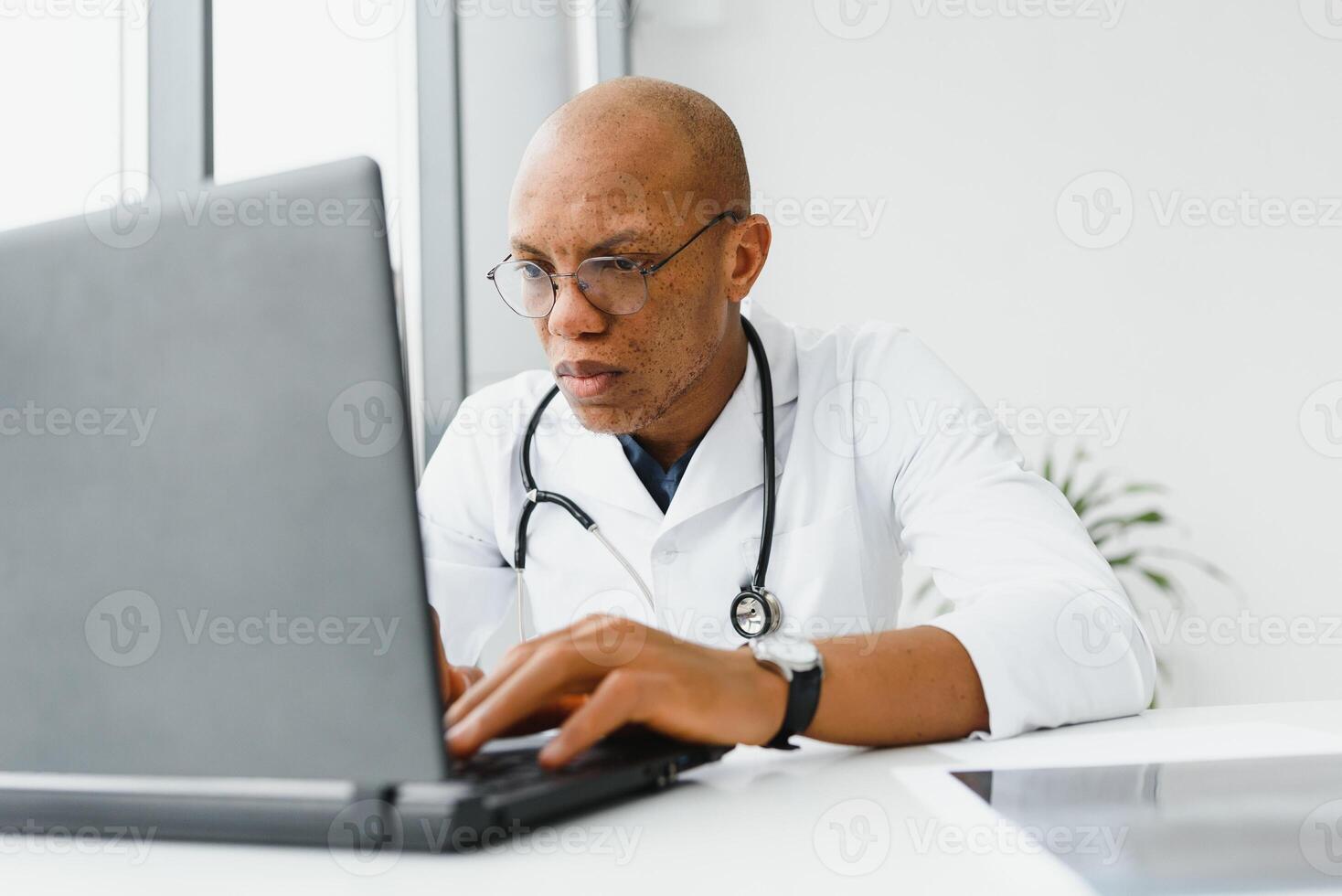 young male african doctor in hospital. photo