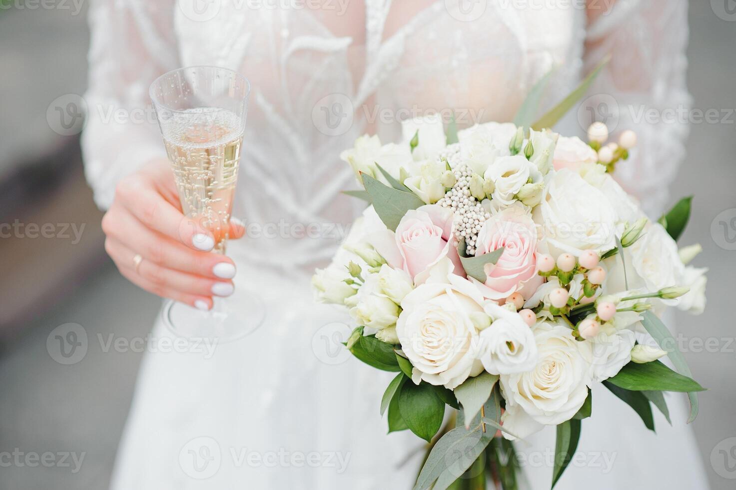Bride holds a wedding bouquet, wedding dress, wedding details. photo