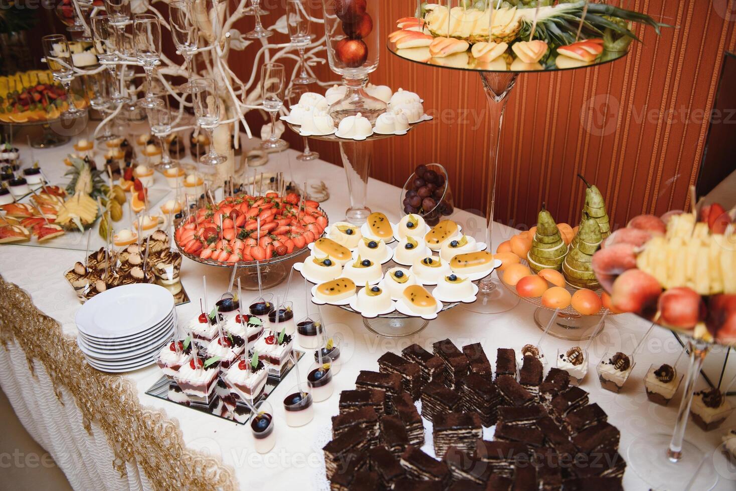 various dessert with fresh fruit on buffet line, sweet. photo