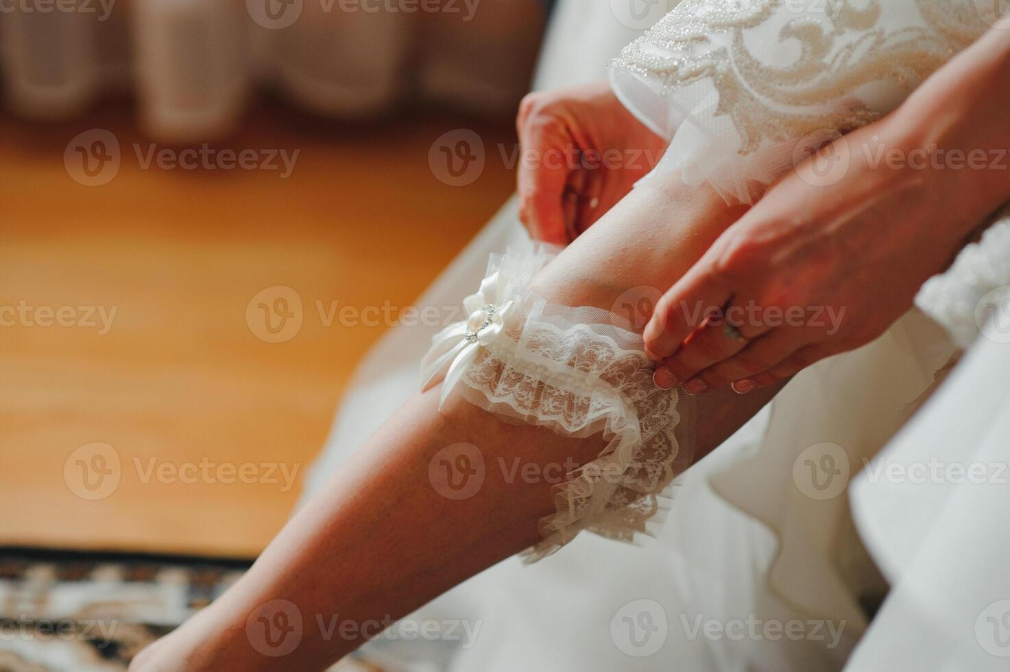 Bride dressing wedding gown. morning bride. photo