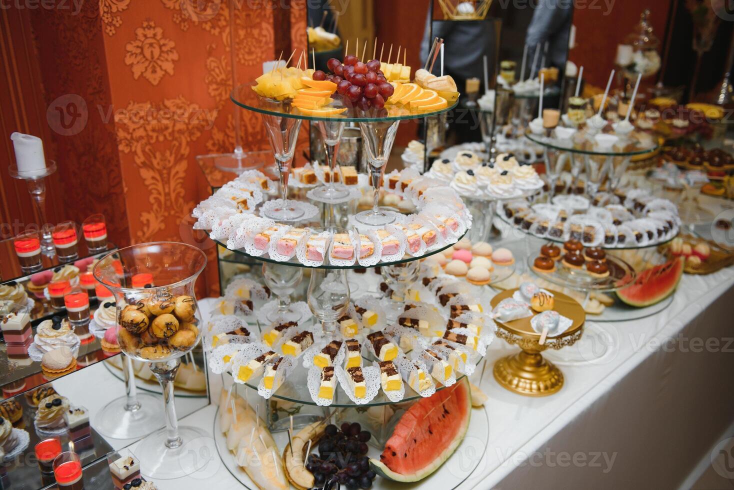 various dessert with fresh fruit on buffet line, sweet. photo