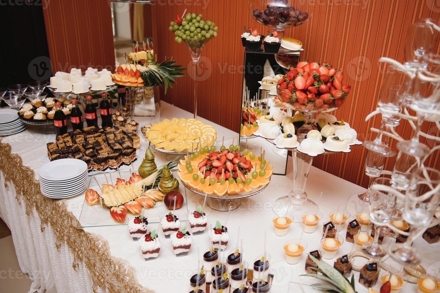various dessert with fresh fruit on buffet line, sweet. photo