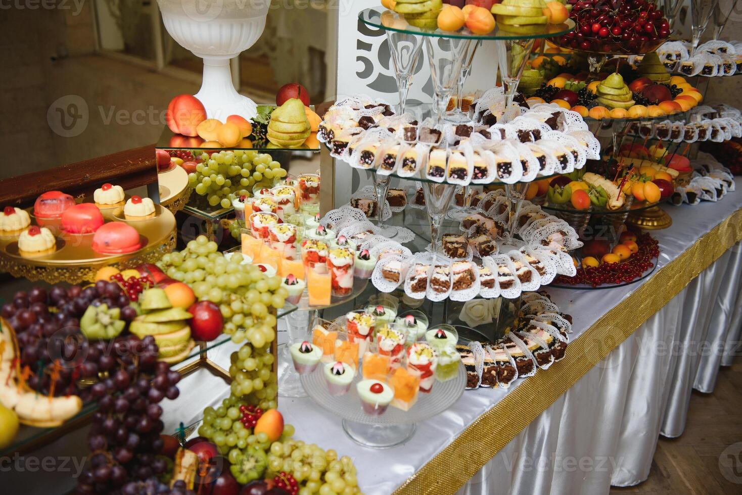 various dessert with fresh fruit on buffet line, sweet. photo