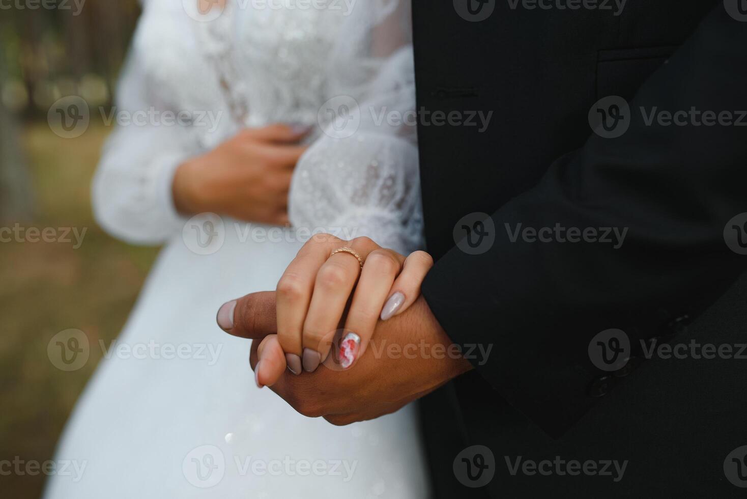 Hands of the bride and groom close-up. photo