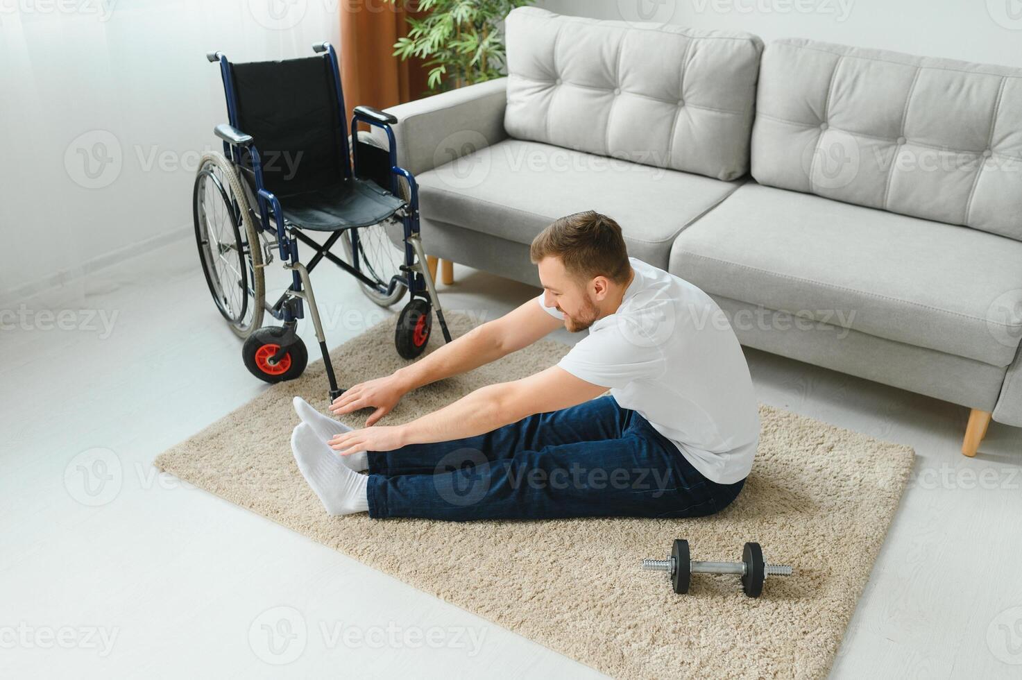 Disabled sportsman doing stretching and exercises on wheelchair background. Life of a disabled person. photo