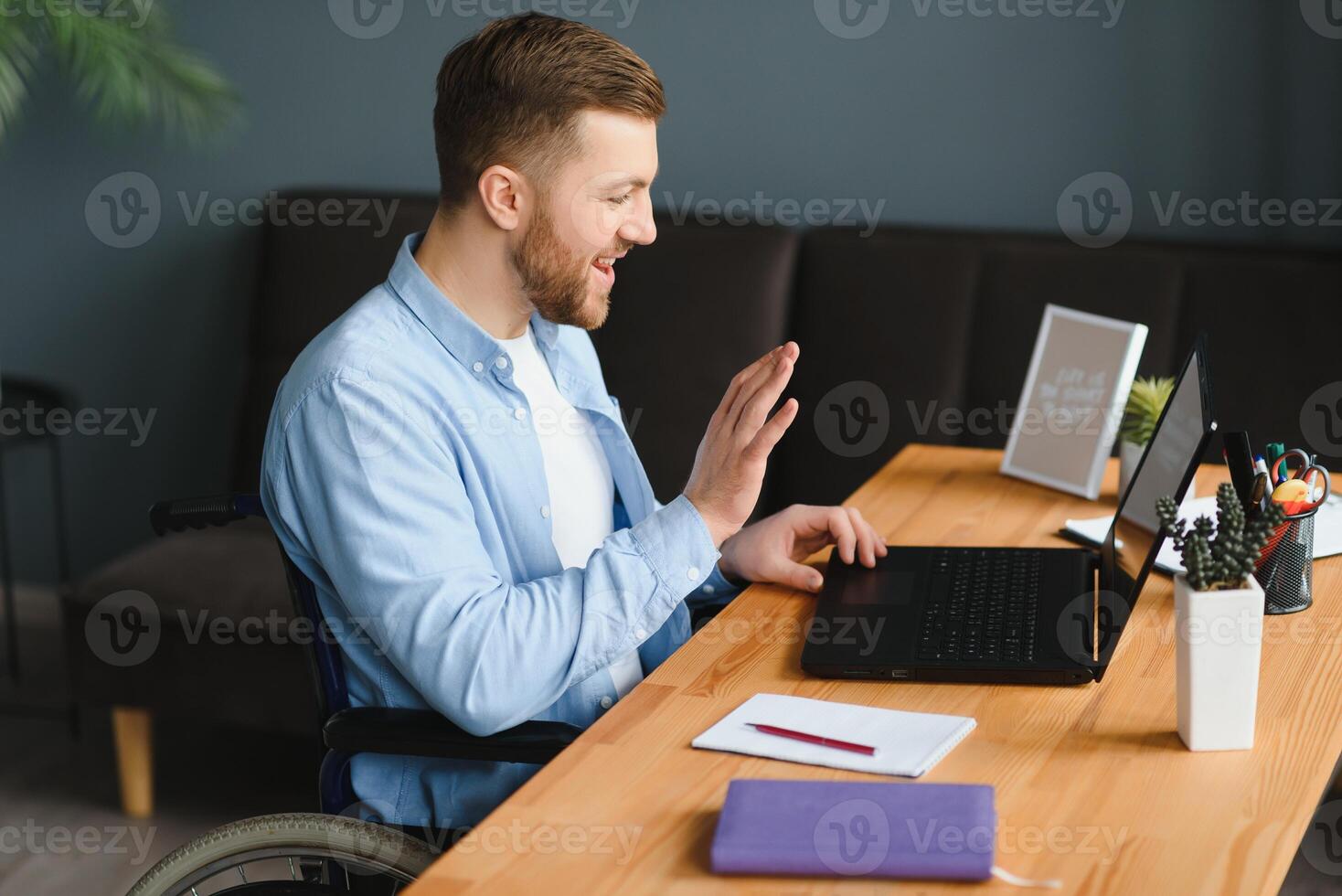 Disabled Virtual Assistant In Wheelchair Making Remote Call. photo