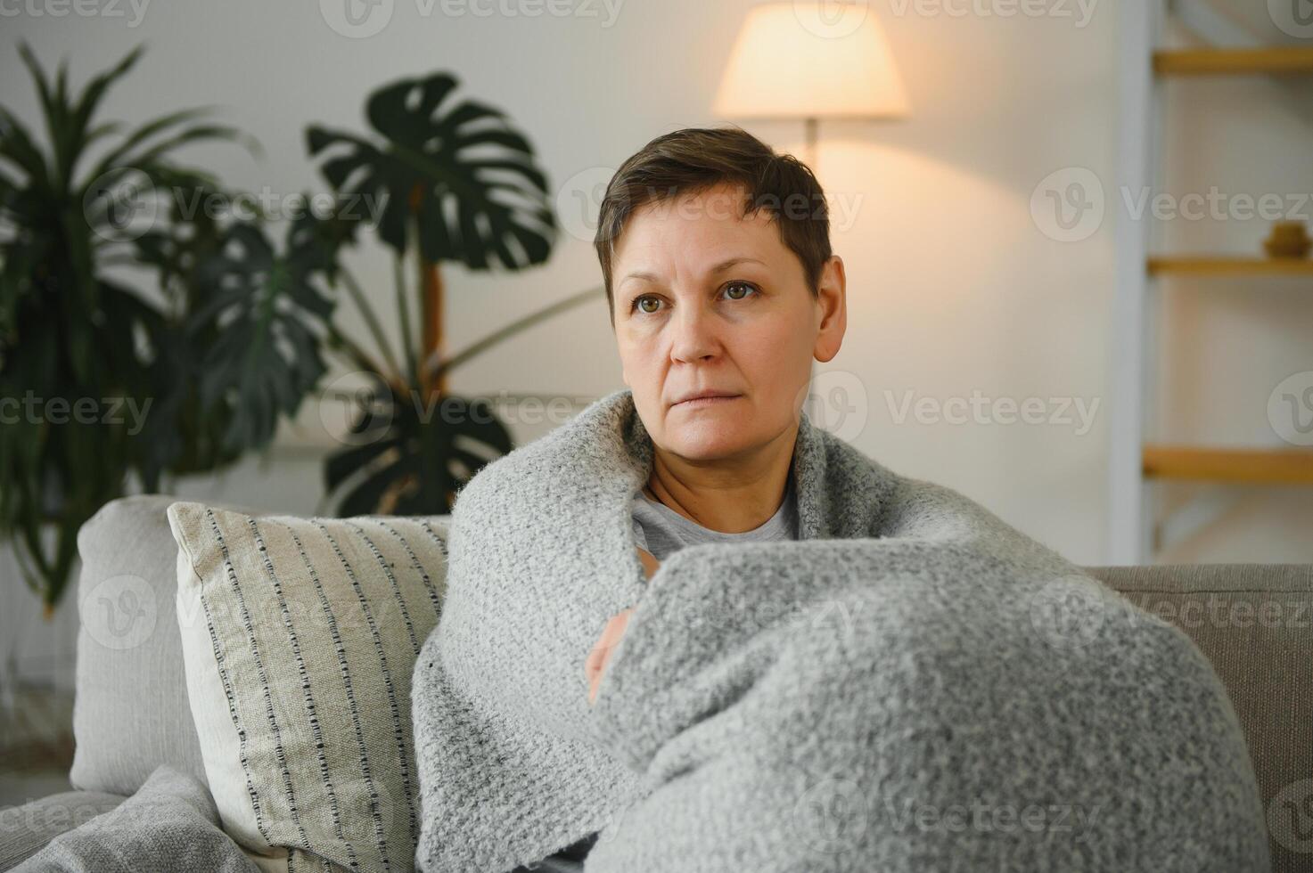 great looking middle aged woman having a calm morning and enjoying her coffee. photo