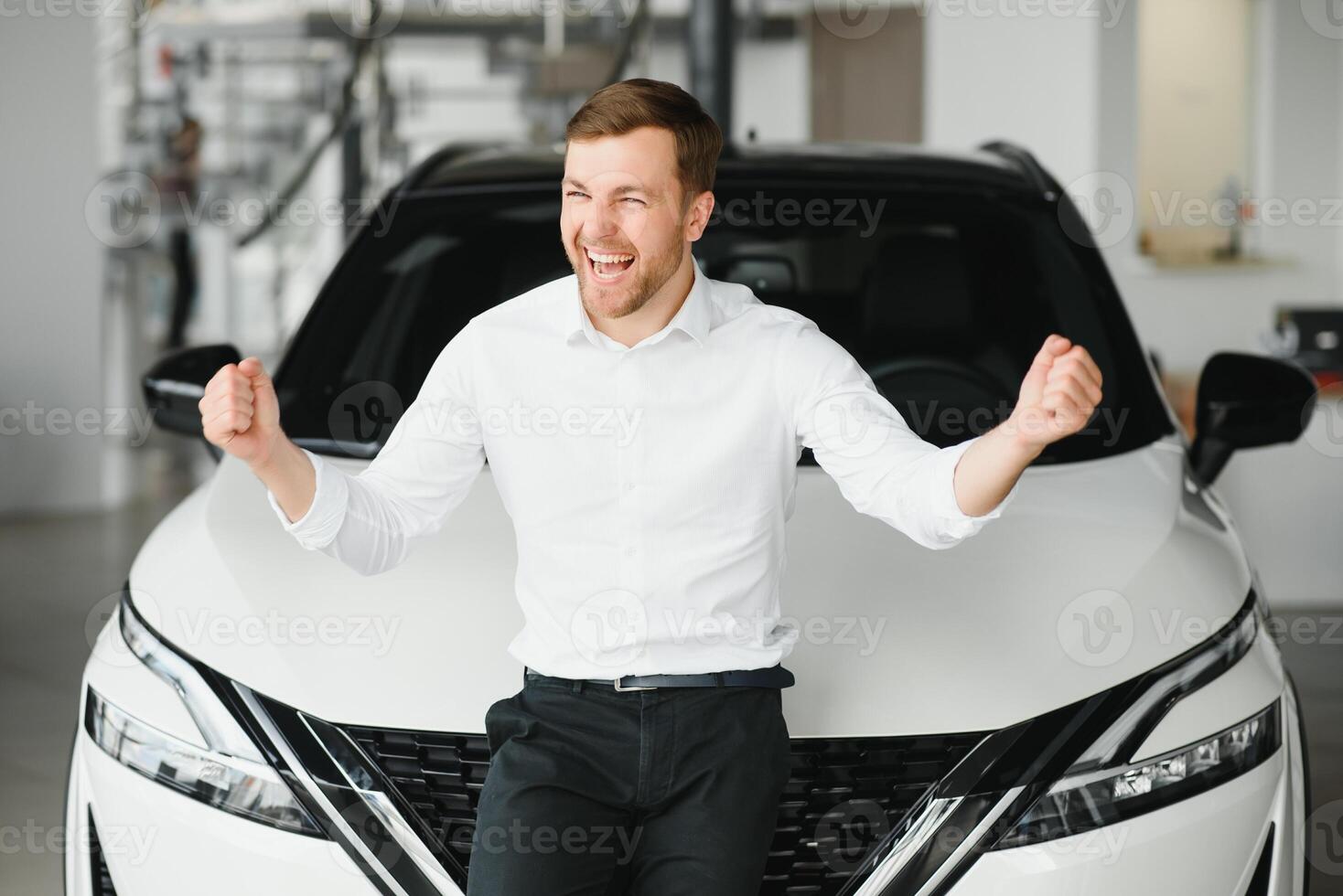 Man buying a car at a showroom photo