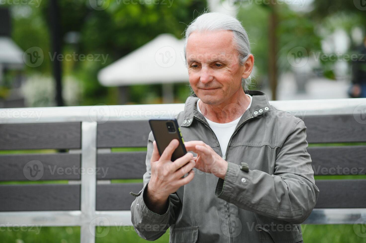 older man have good time in the park photo