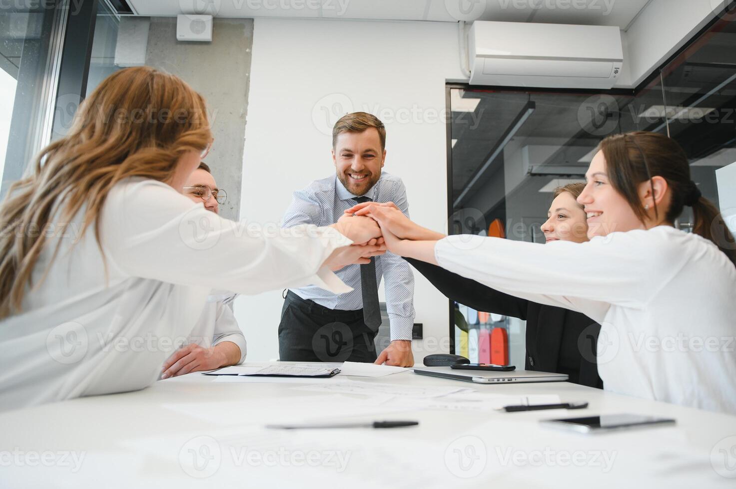 Corporate business team and manager in a meeting room at modern office with panoramic windows. Business concept photo