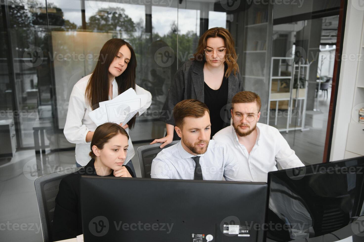 Corporate business team and manager in a meeting room at modern office with panoramic windows. Business concept photo