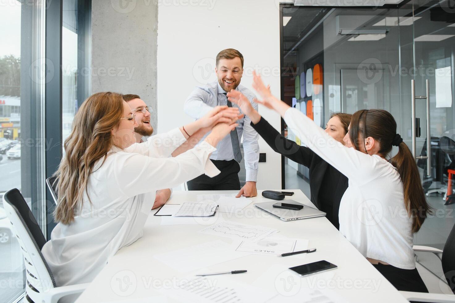 A group of business people partners during a set team meeting in the modern office. Teamwork concept photo