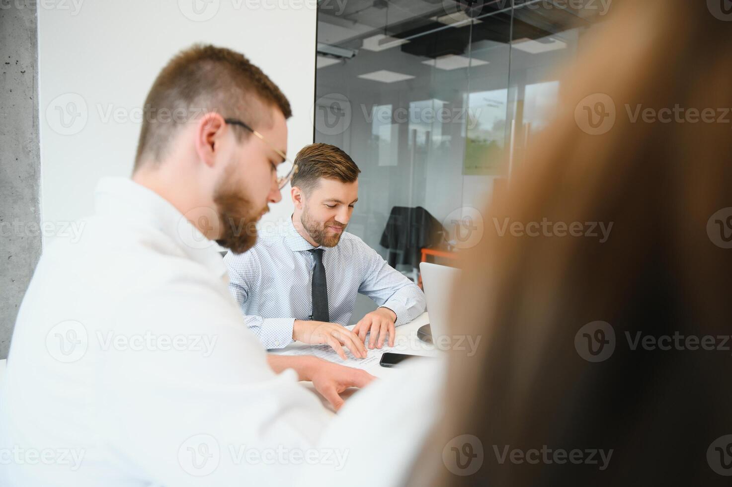 A group of business people partners during a set team meeting in the modern office. Teamwork concept photo