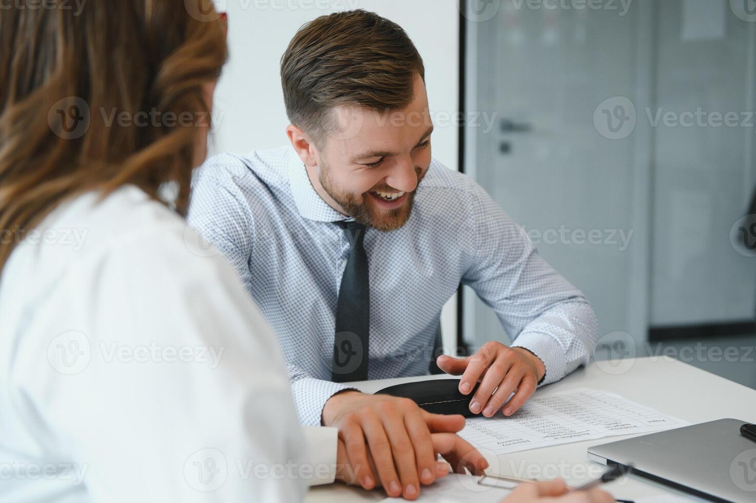 Confident and successful team. Group of people are working together in office. Blurred background photo