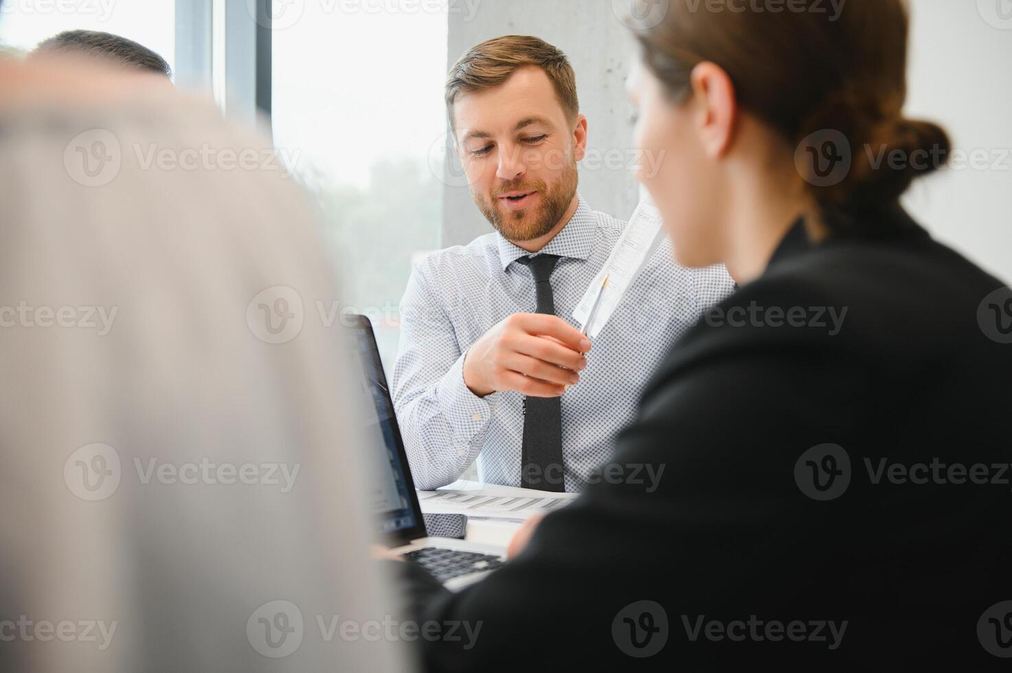 Corporate business team and manager in a meeting room at modern office with panoramic windows. Business concept photo