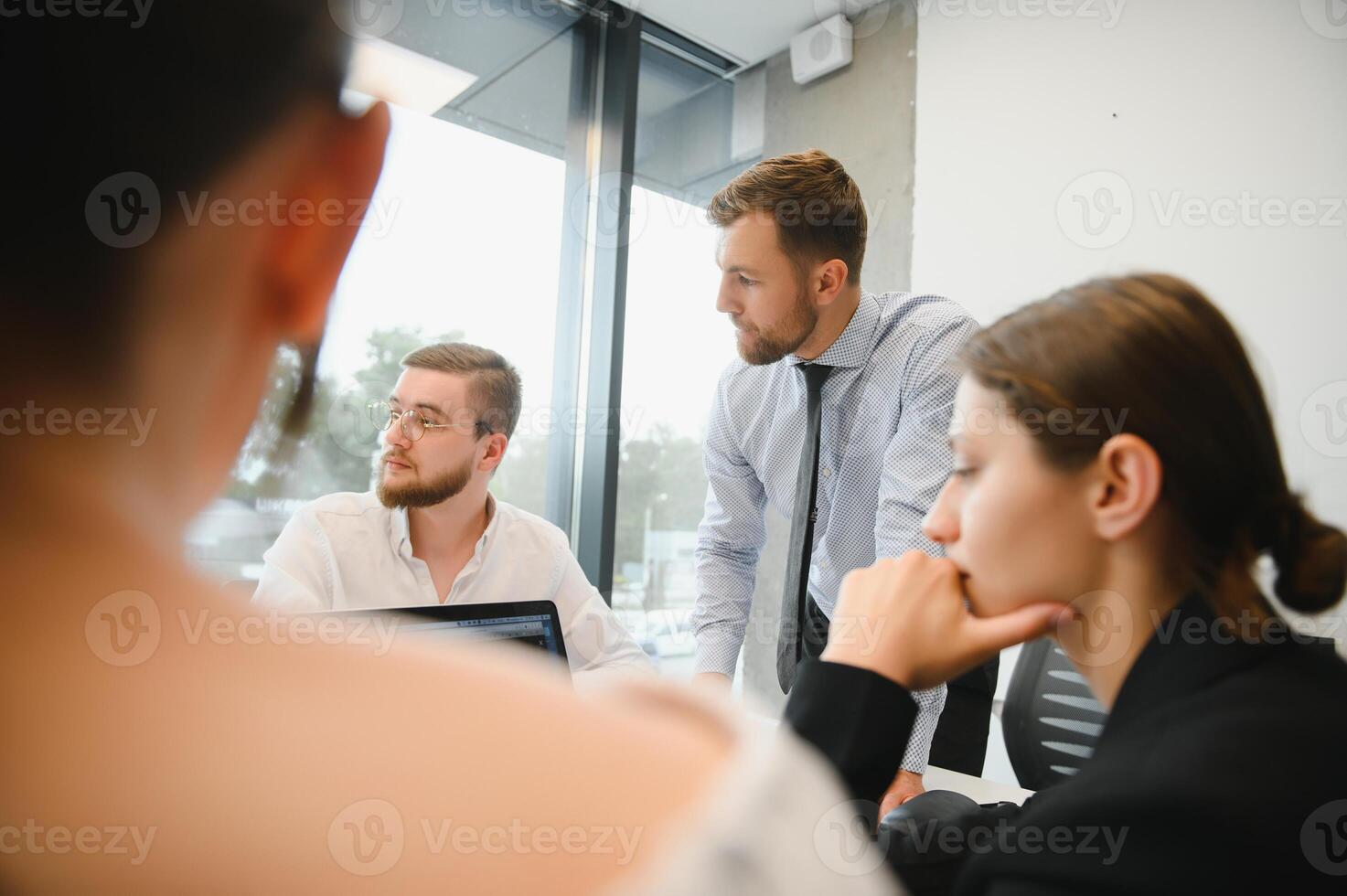 A group of business people partners during a set team meeting in the modern office. Teamwork concept photo