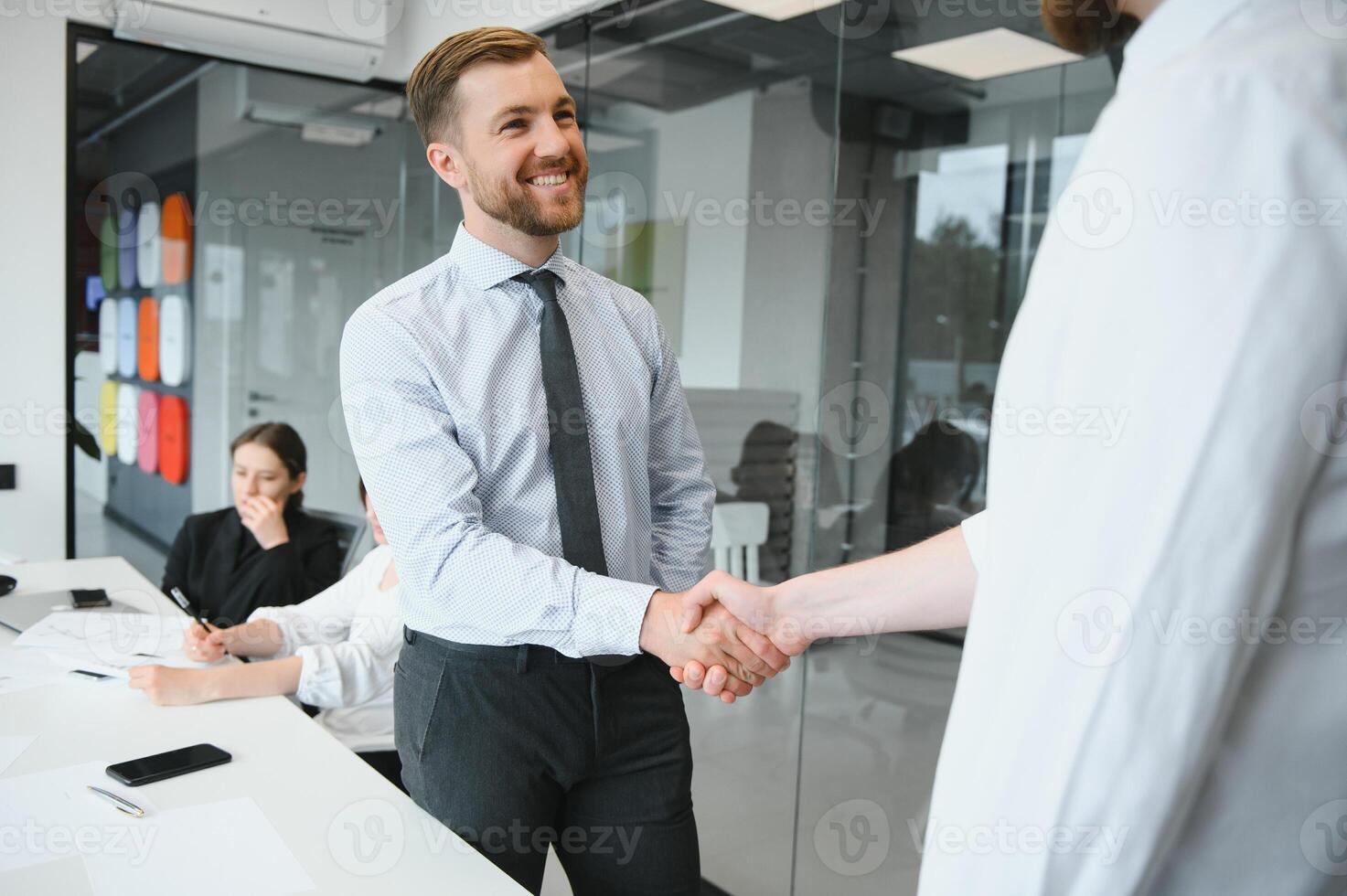 A group of business people partners during a set team meeting in the modern office. Teamwork concept photo