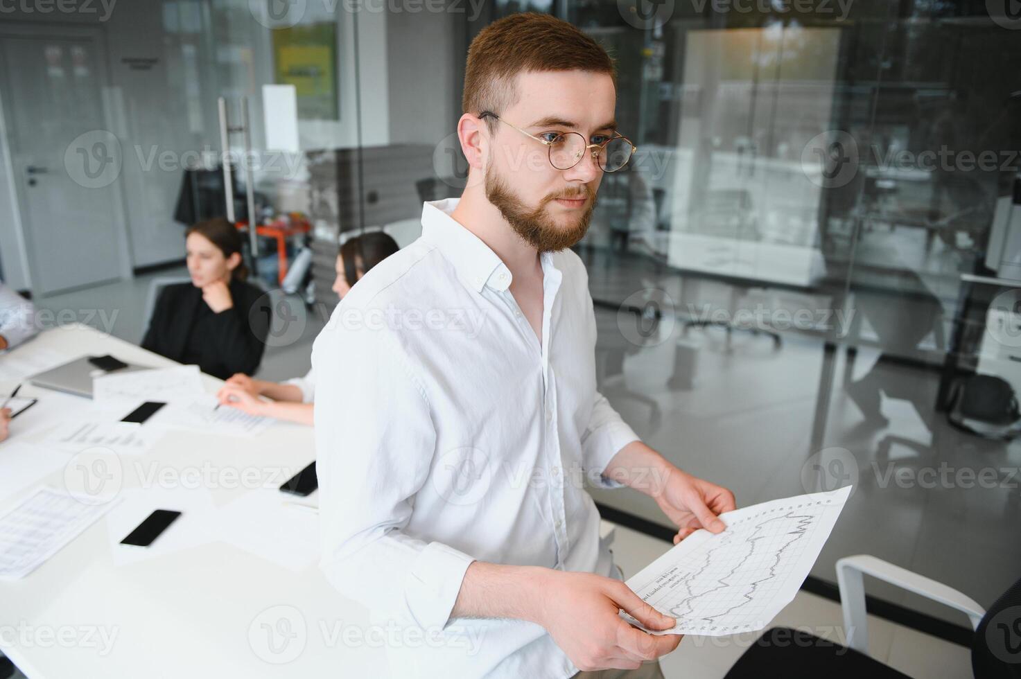 Corporate business team and manager in a meeting room at modern office with panoramic windows. Business concept photo