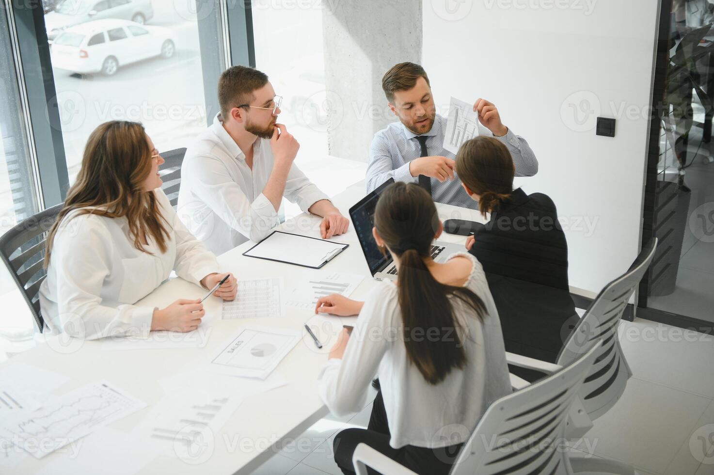 Corporate business team and in a meeting at modern office with big windows . High quality photo