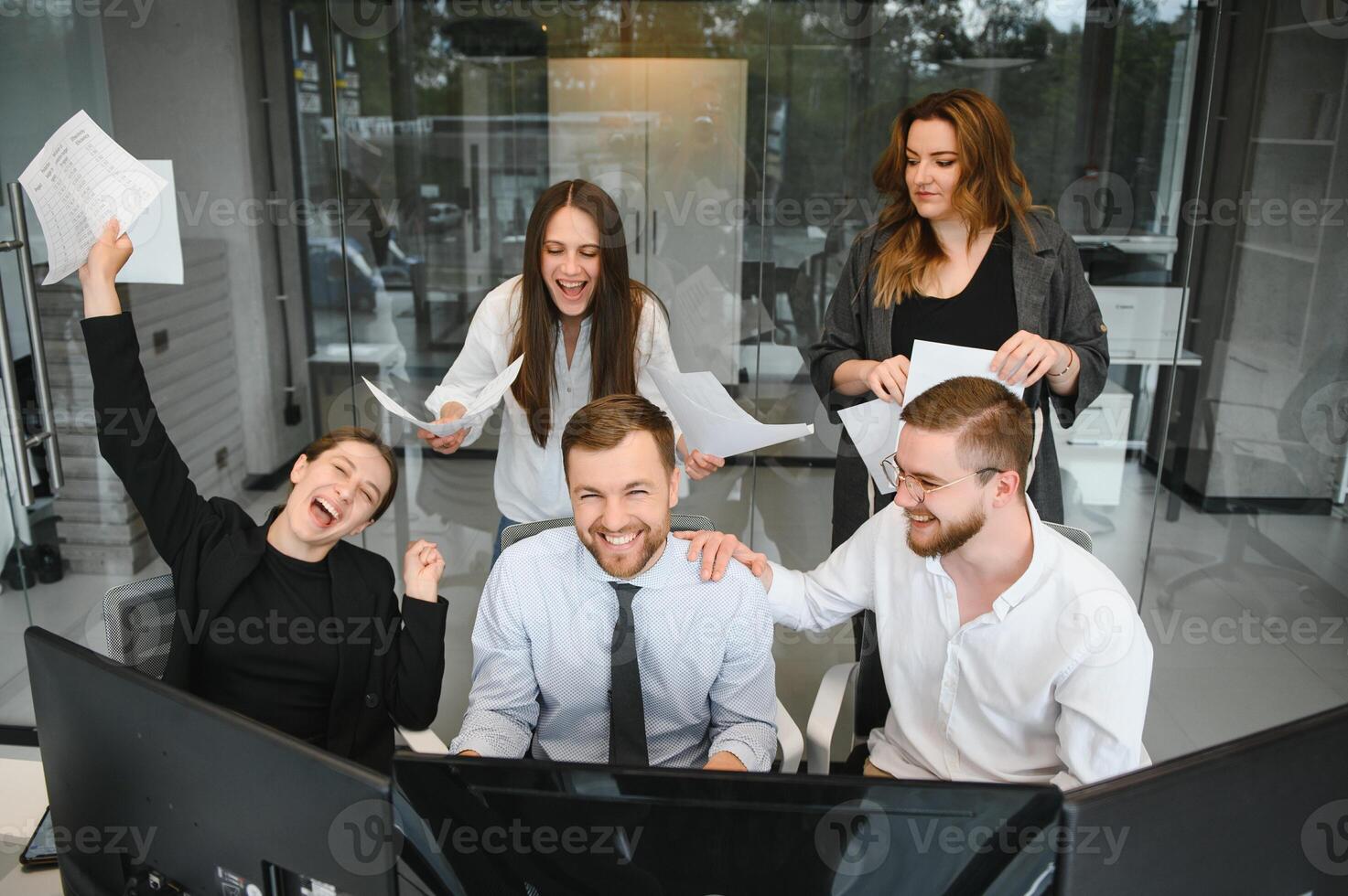 Group of businessmen and businesswomen stock brokers working at office. photo