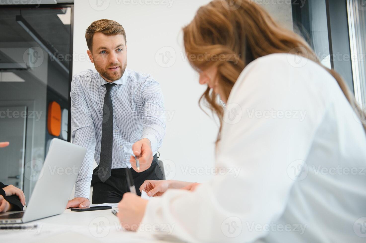 A group of business people partners during a set team meeting in the modern office. Teamwork concept photo