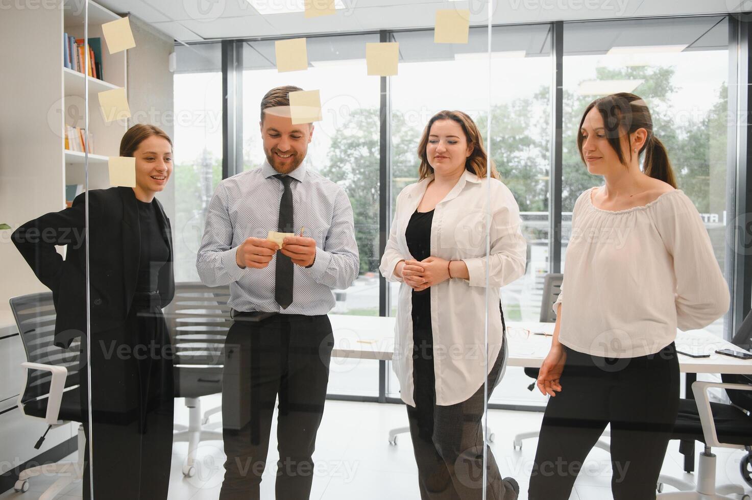 Corporate business team and manager in a meeting room at modern office with panoramic windows. Business concept photo
