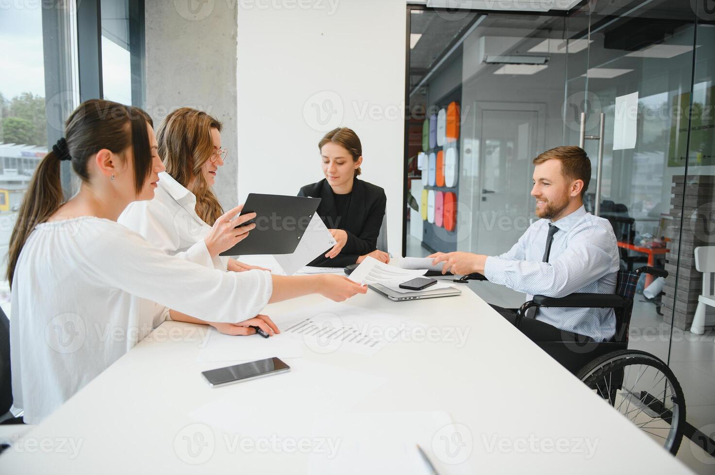 Corporate business team and manager in a meeting room at modern office with panoramic windows. Business concept photo