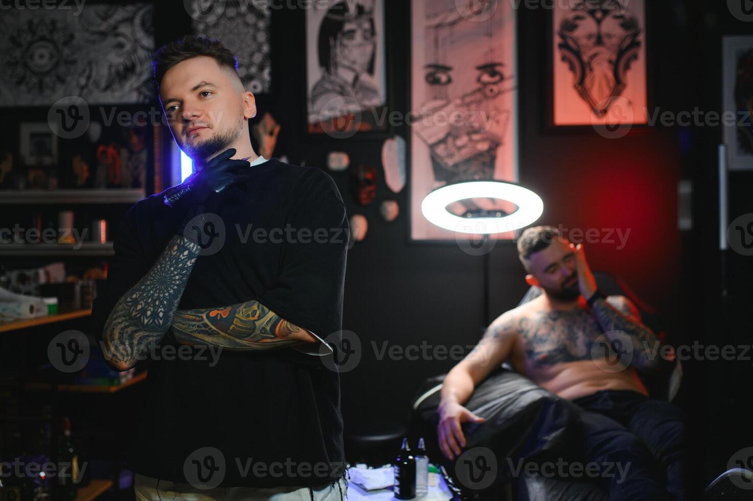 Portrait Of Tattoo Artist Standing Inside Parlor photo