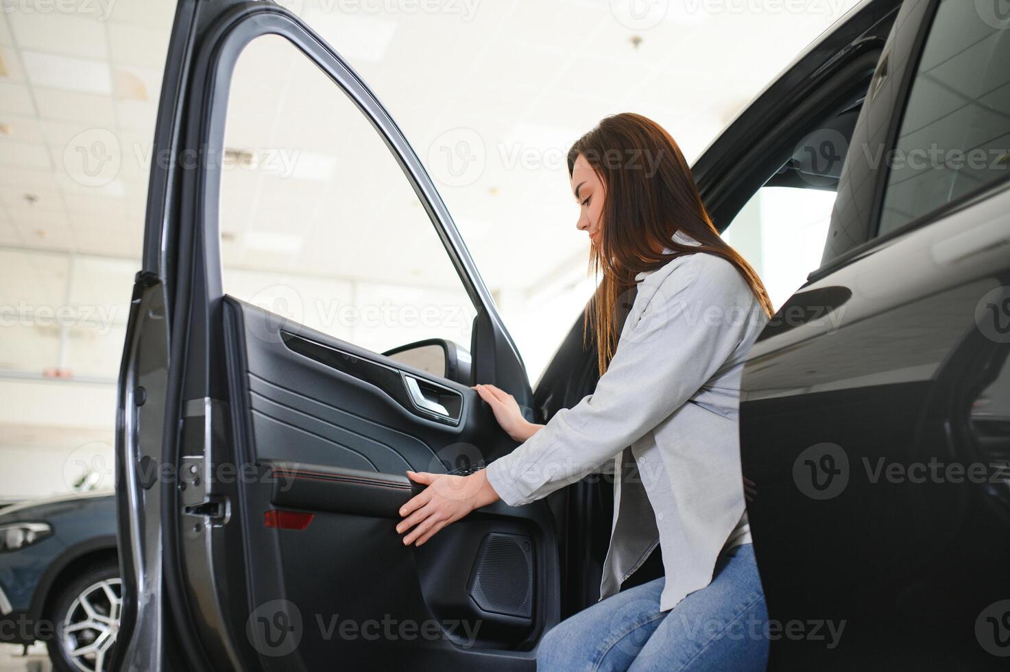 woman customer female buyer client chooses auto. Sales concept photo