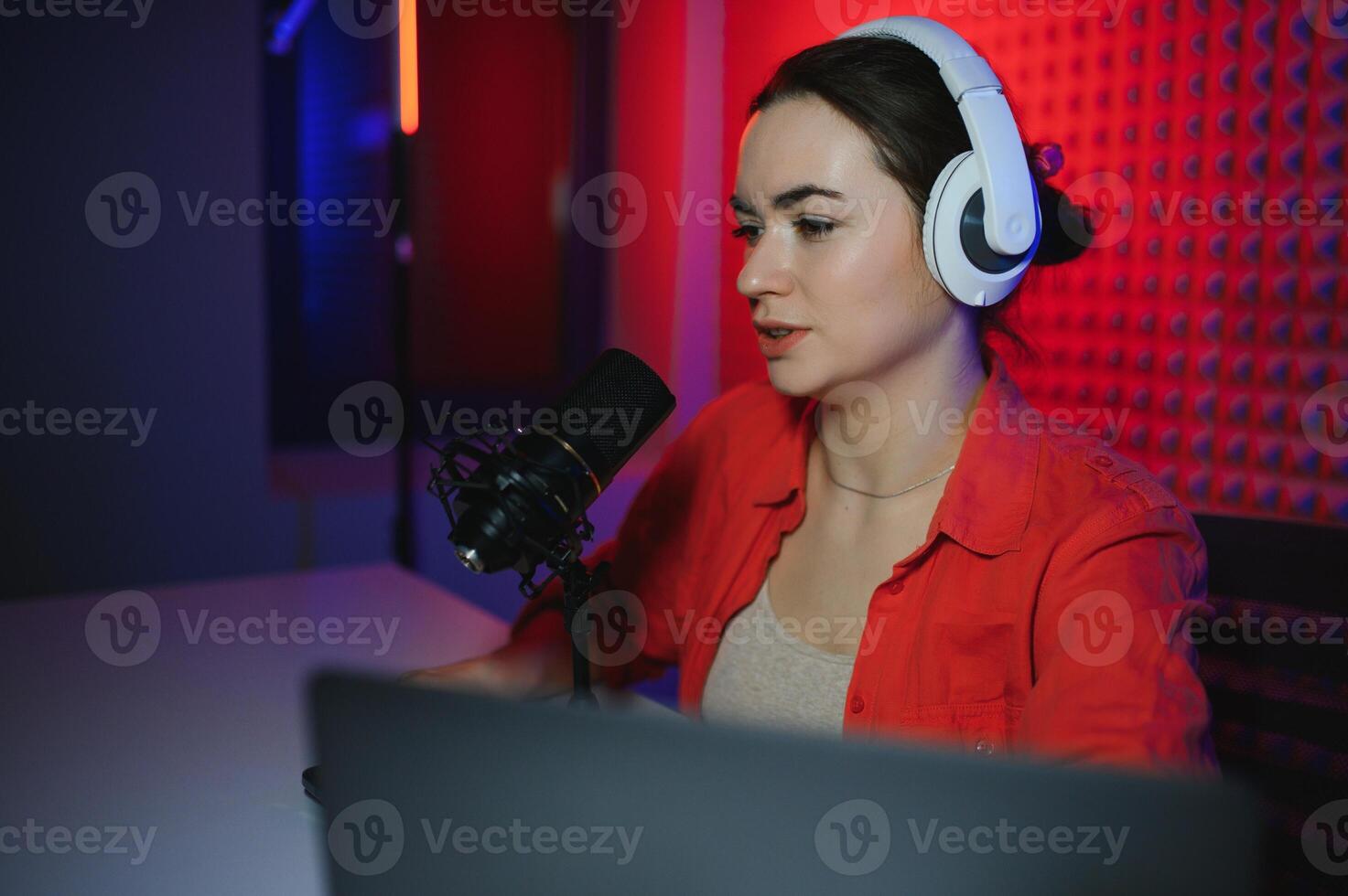 Young woman blogger recording on camera photo